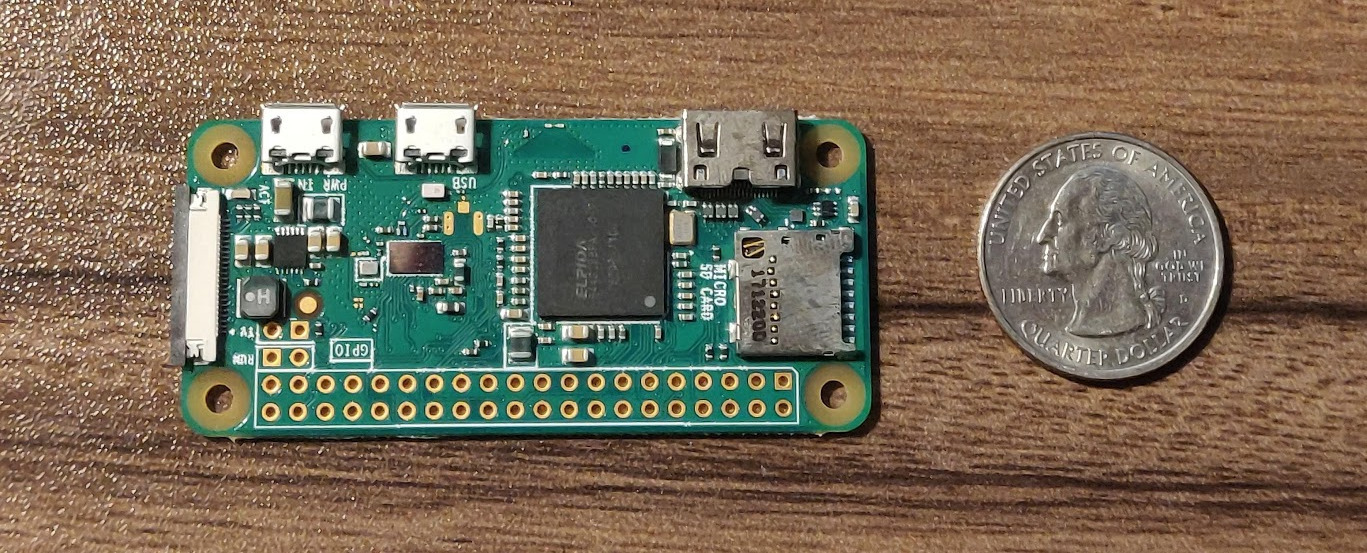 Pi Zero next to a quarter Pi Zero Quarter